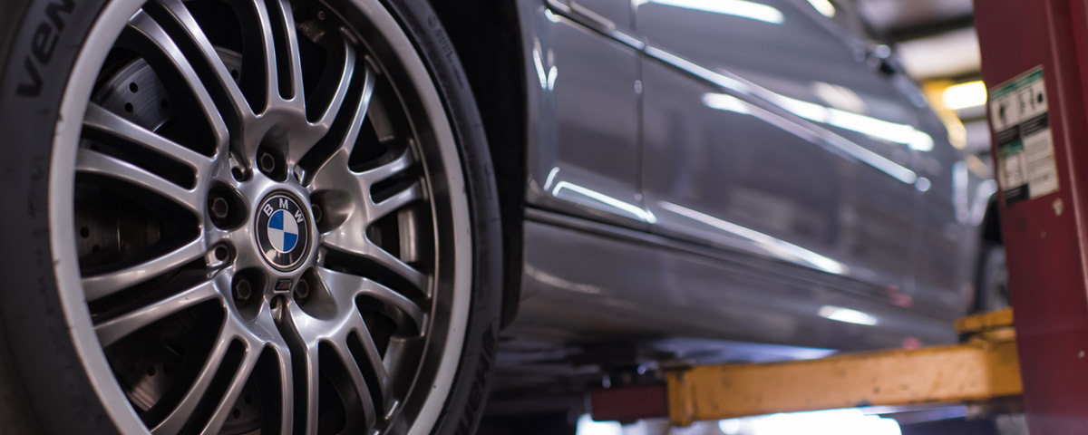 Closeup of car wheels at a BMW service shop in Denver, CO