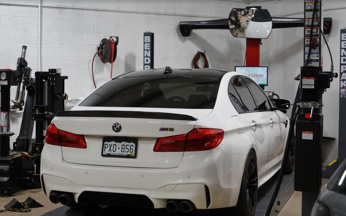 A white BMW at the service center for BMW brake service and repair in Denver, CO. Get expert repair.