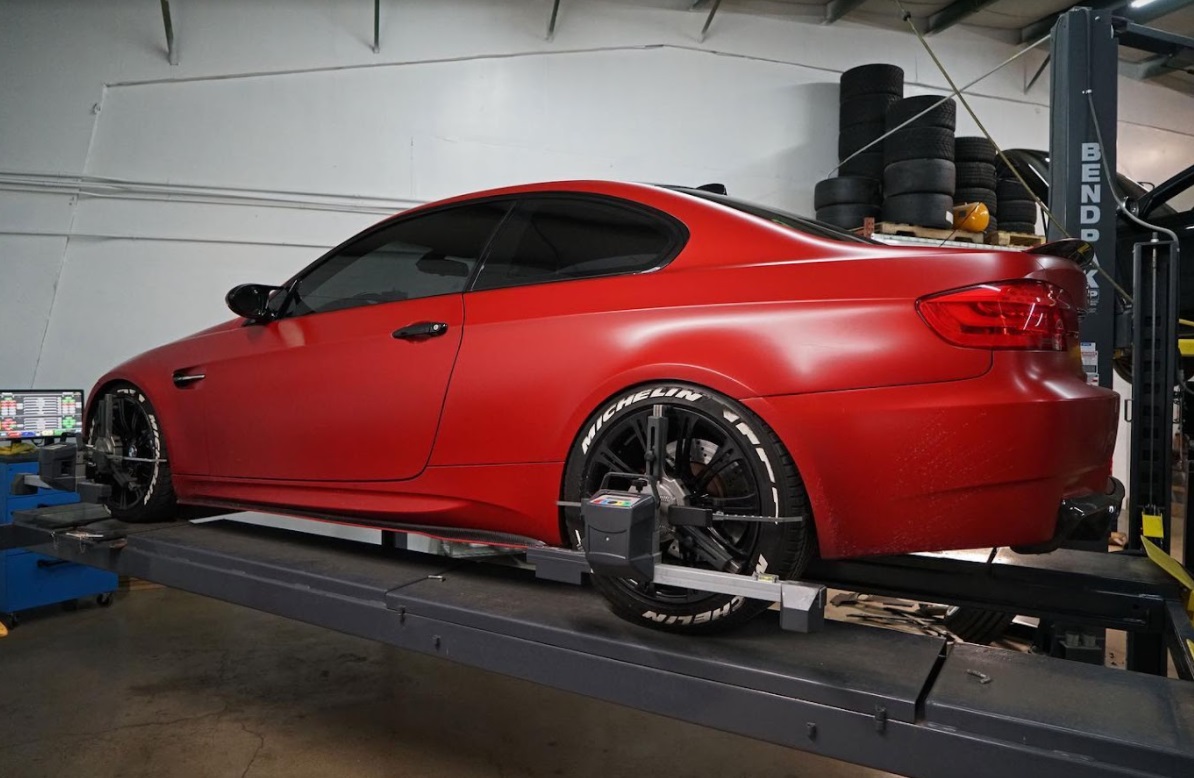 A red BMW at the service center for a routine BMW brake service, repair, and maintenance in Denver, CO