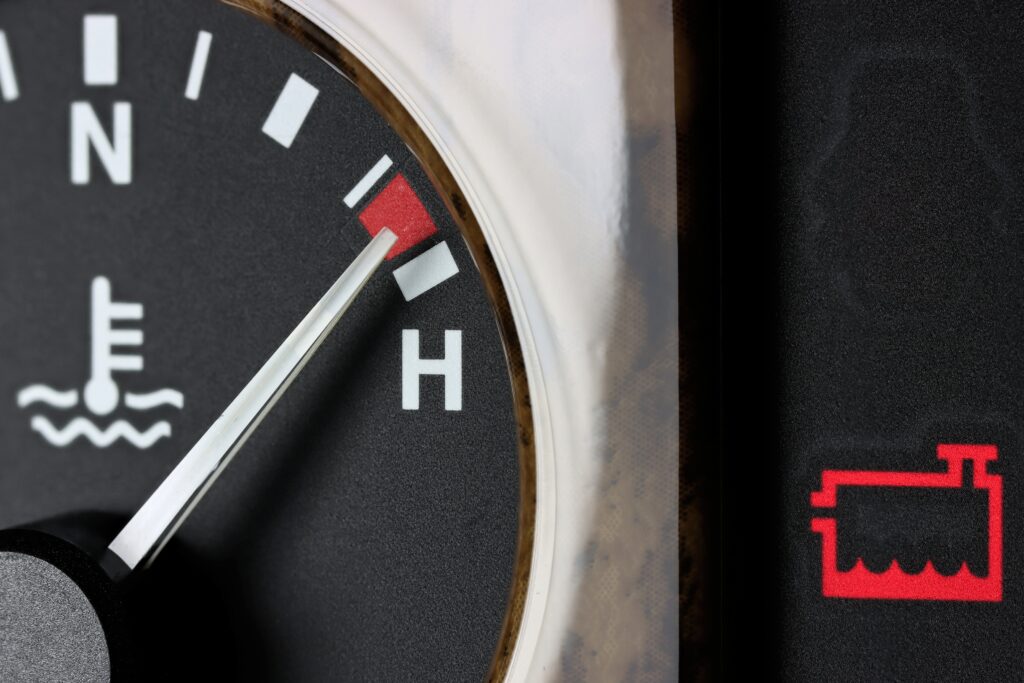 The coolant warning light on your car dashboard indicates that your engine’s coolant level is low.