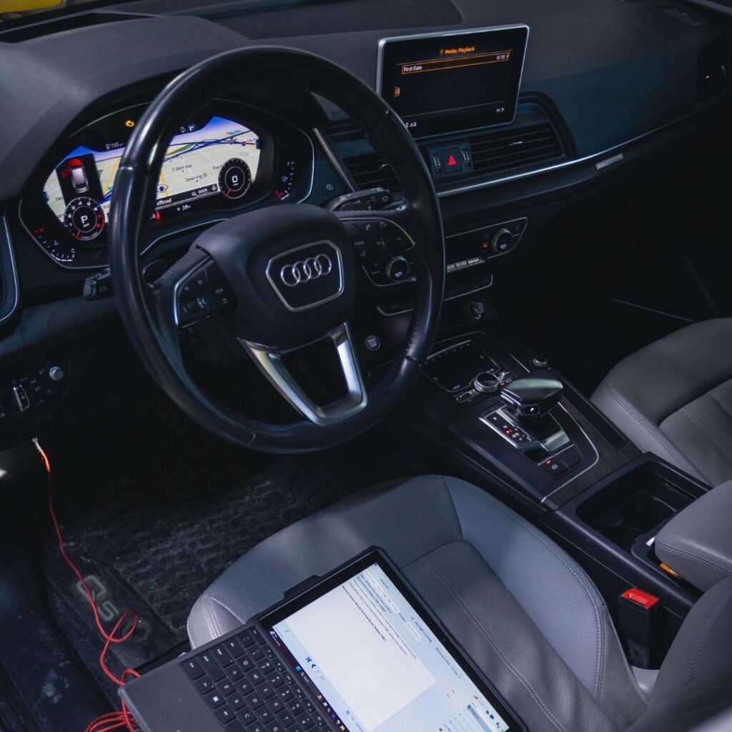 Close-up of a fully functional and bright Audi center console interface displaying digital media settings.