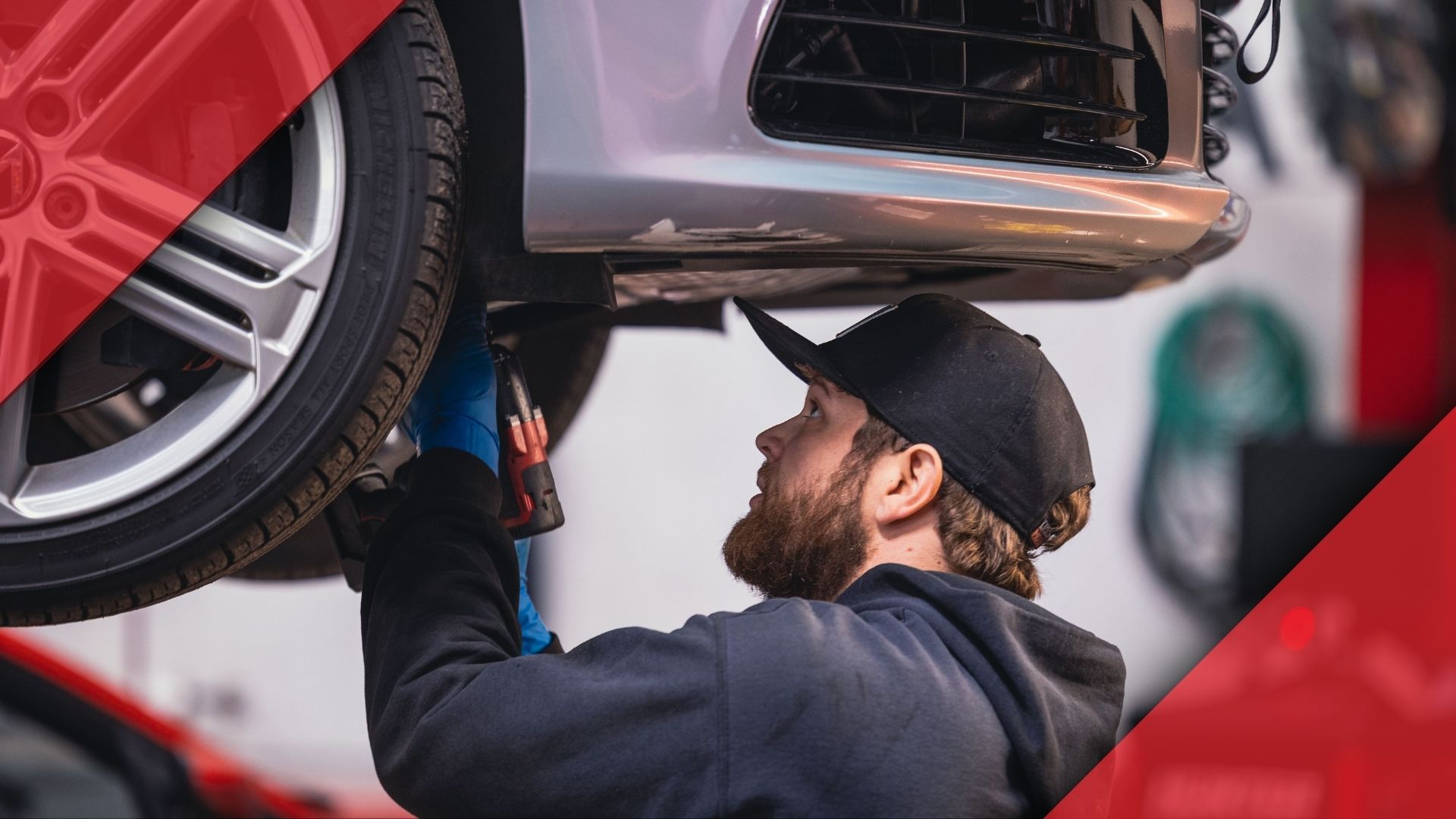 Mechanic working on BMW suspension.